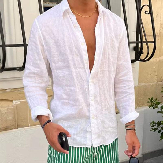 Men's white casual linen long sleeve button-up shirt with turn-down collar, styled with rolled cuffs and paired with green striped shorts.
